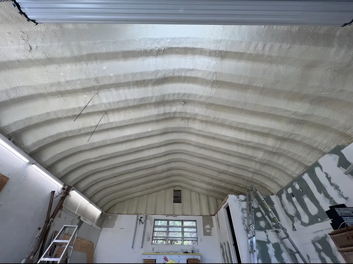 Spray polyurethane foam applied to the underside of a metal roof deck in Meridian